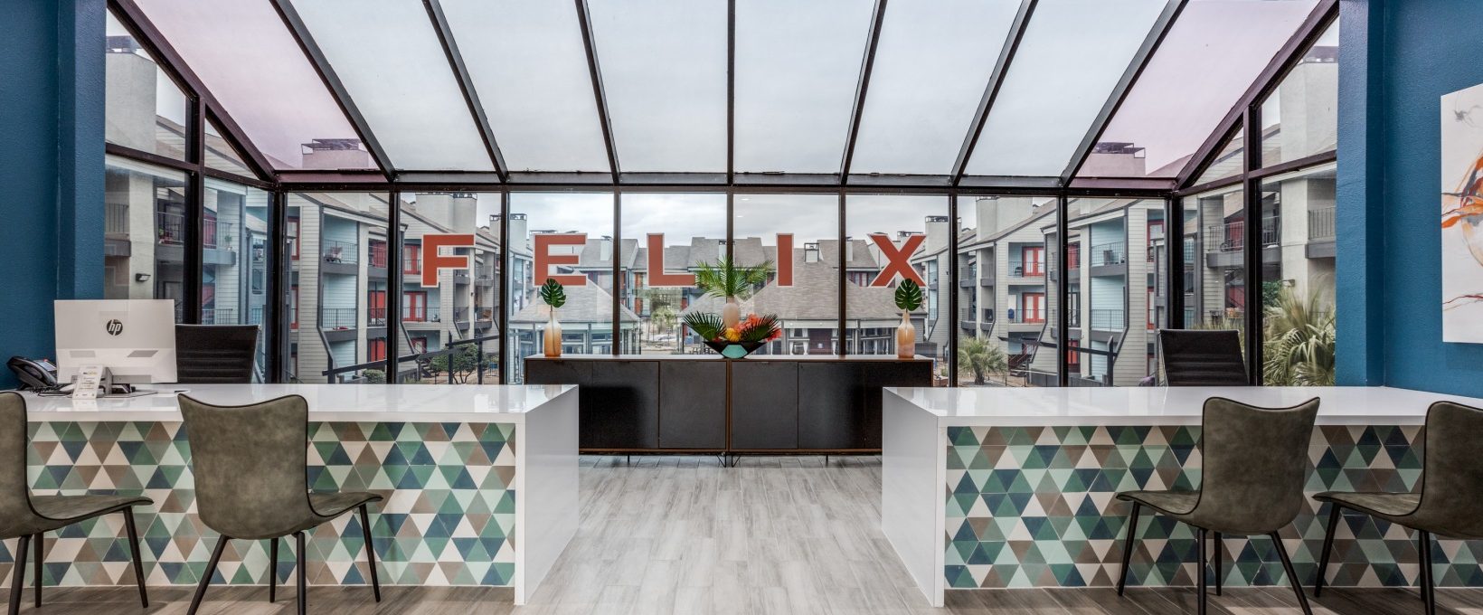 the lobby of a modern office building with a large glass wall at The Felix