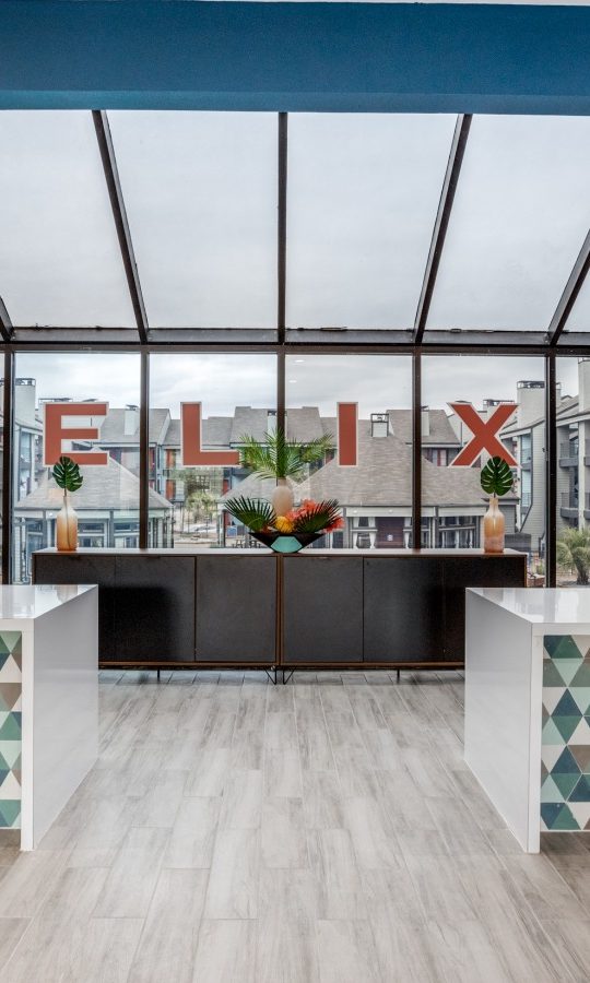 the lobby of a modern office building with a large glass wall at The Felix