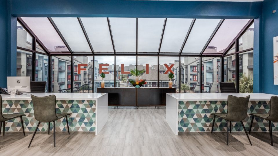 the lobby of a modern office building with a large glass wall at The Felix